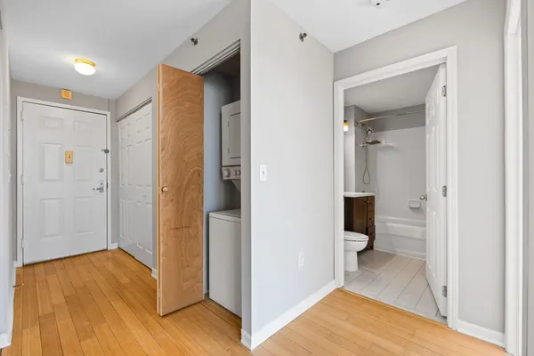 a kitchen with a sink and a refrigerator