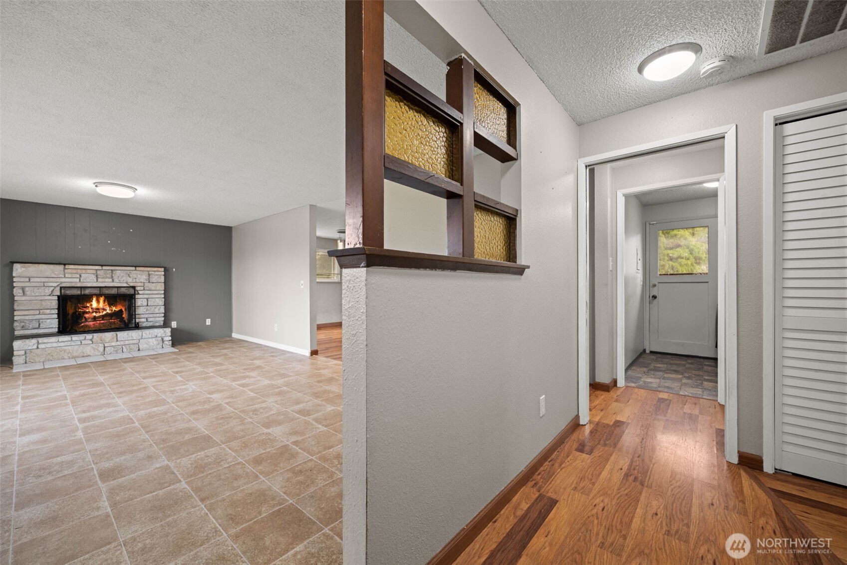 1209 Dundee Drive Cosmopolis, WA 98537 - Photo 17 of 40 a view of an empty room with wooden floor and a window