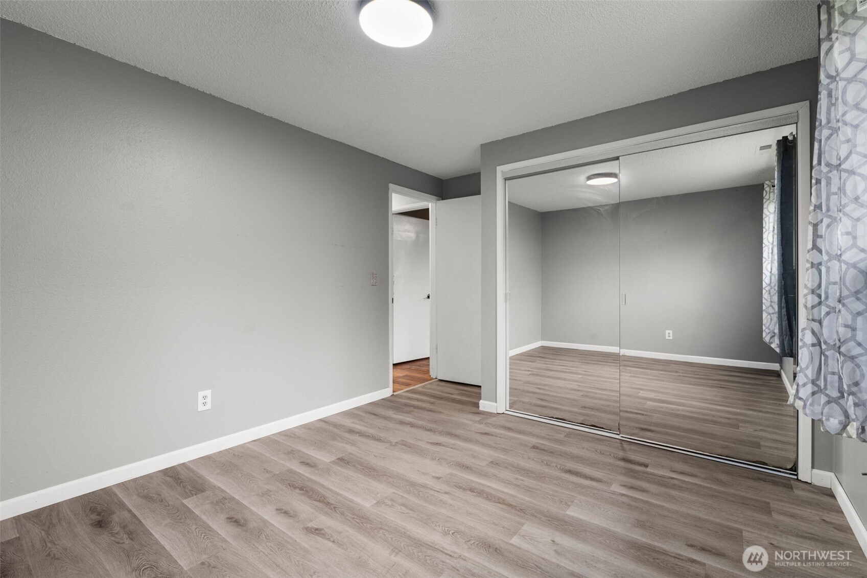 1209 Dundee Drive Cosmopolis, WA 98537 - Photo 7 of 40 a view of empty room with wooden floor