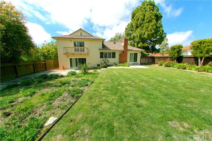 Huge flat backyard is fully fenced.