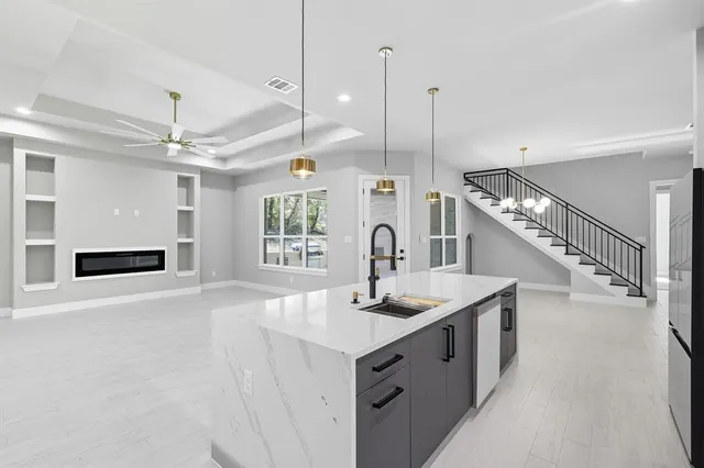 a kitchen with counter top and stove