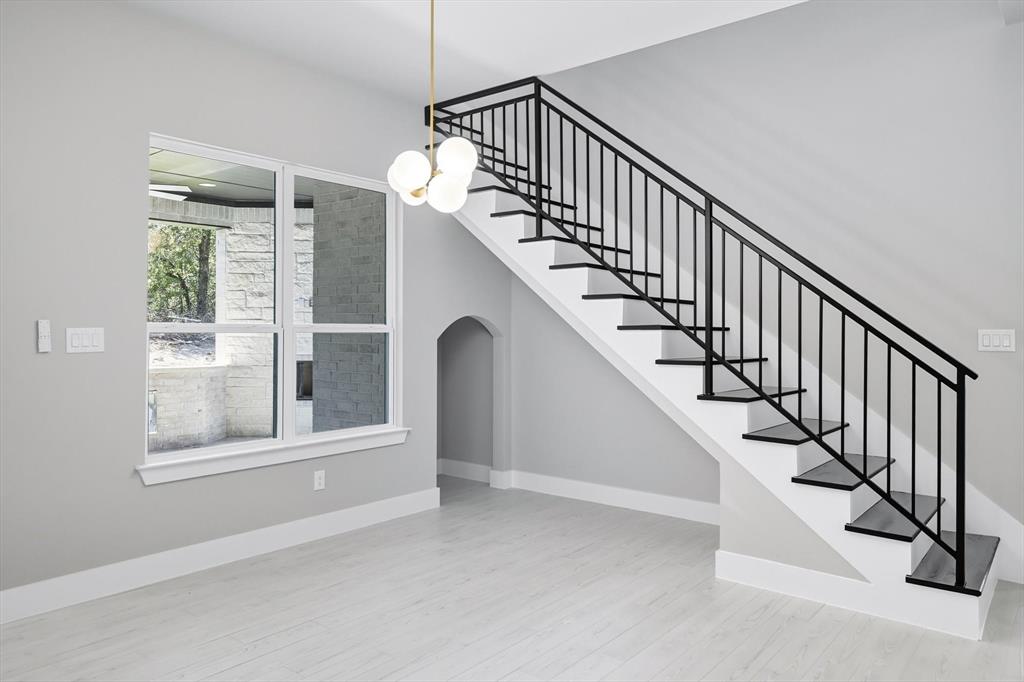 1040 Andy Ranch Azle, TX 76020 - Photo 16 of 33 a view of staircase with lots of windows and white walls