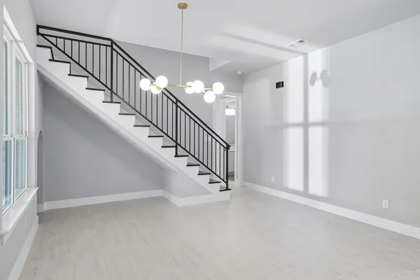 a view of a hallway with staircase