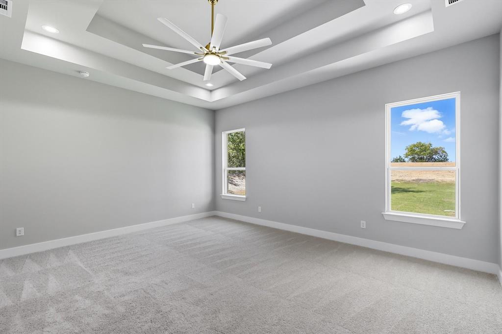 1040 Andy Ranch Azle, TX 76020 - Photo 18 of 33 an empty room with a window and a fan