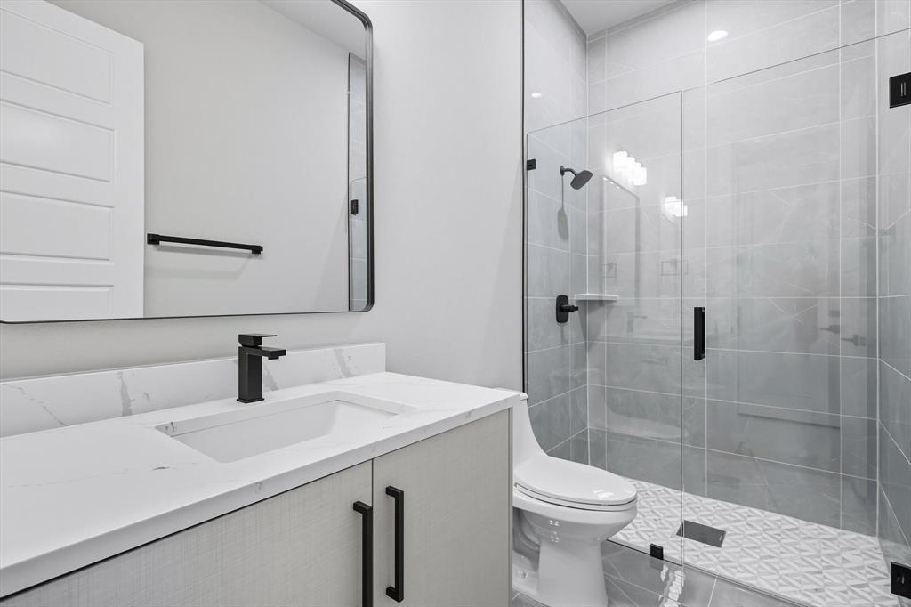 1040 Andy Ranch Azle, TX 76020 - Photo 24 of 33 a bathroom with a sink a toilet and shower