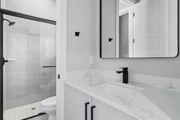 a bathroom with a sink and a toilet