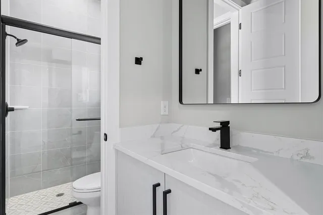 a bathroom with a sink and a toilet