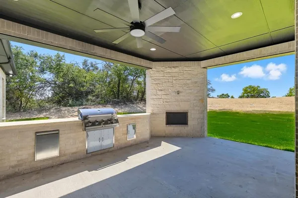 a kitchen with a stove and a microwave oven