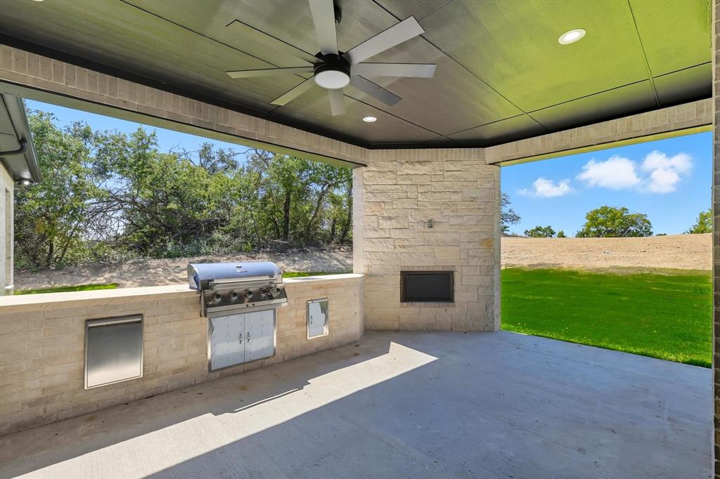 1040 Andy Ranch Azle, TX 76020 - Photo 29 of 33 a kitchen with a stove and a microwave oven