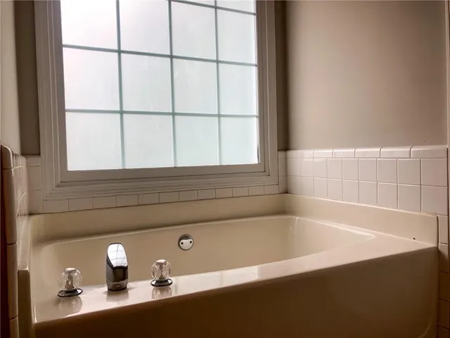 a bathroom with a glass shower door