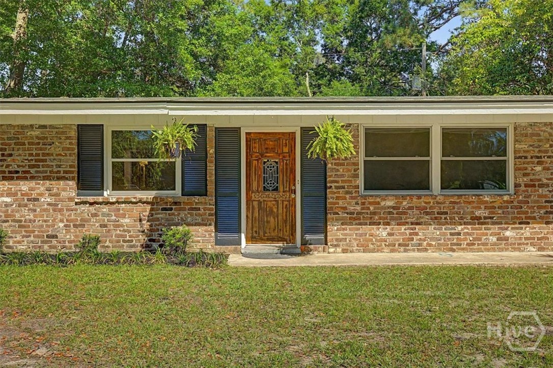 12407 Deerfield Road Savannah, GA 31419 - Photo 1 of 34 Original Savannah Grey Brick exterior and freshly painted Charleston Green Shutters