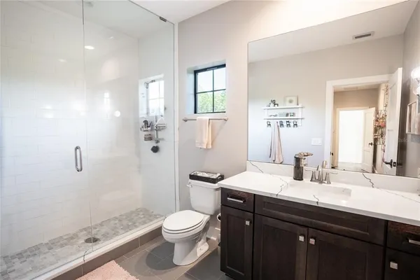 a kitchen with lots of counter top space and stainless steel appliances