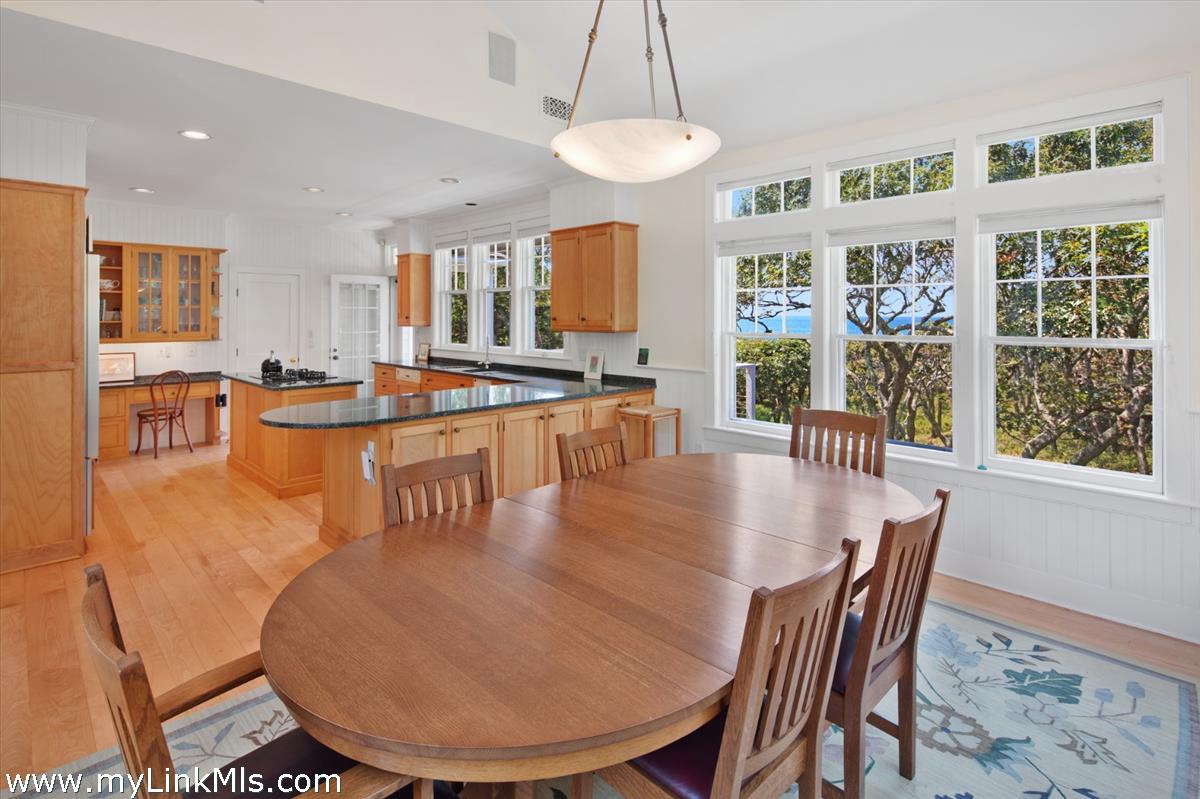 78 Hammett Road Chilmark, MA 02535 - Photo 31 of 53 a dining room with furniture a chandelier and wooden floor
