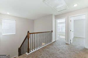 11149 Cornerstone Lane Hampton, GA 30228 - Photo 18 of 29 a view of a hallway to a room with stairs