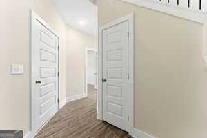 11149 Cornerstone Lane Hampton, GA 30228 - Photo 7 of 29 a view of a hallway with wooden floor