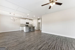 11149 Cornerstone Lane Hampton, GA 30228 - Photo 9 of 29 a view of a kitchen with a sink and a microwave