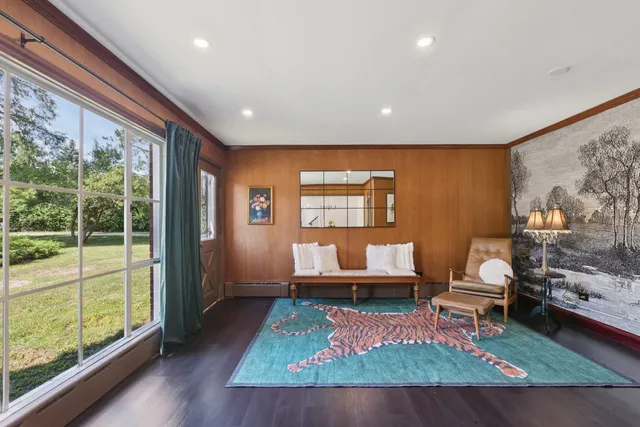 a view of a dining room with furniture window and outside view