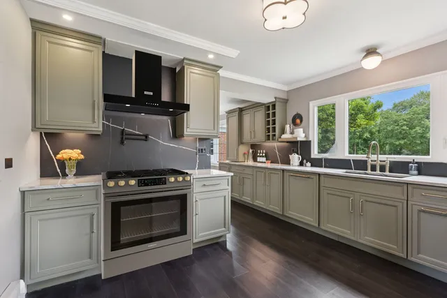 a view of a hallway with a livingroom and a window