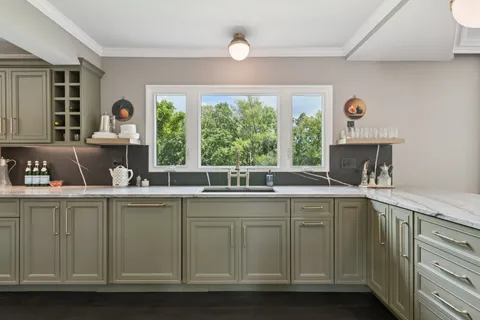 a bathroom with a toilet a sink a vanity and mirror