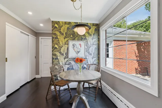 a view of a hallway with wooden floor and stairs