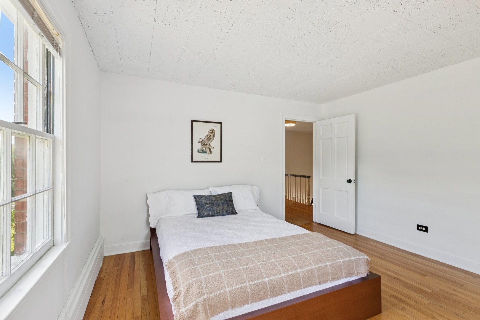 60 Ridge Road Barrington Hills, IL 60010 - Photo 41 of 70 a bedroom with a large bed and wooden floor