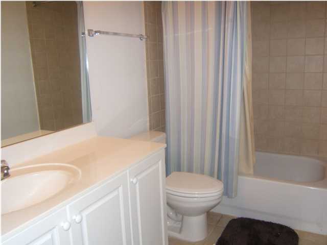 520 Santa Rosa Boulevard, Unit 110 Fort Walton Beach, FL 32548 - Photo 12 of 21 a bathroom with a sink a toilet and shower