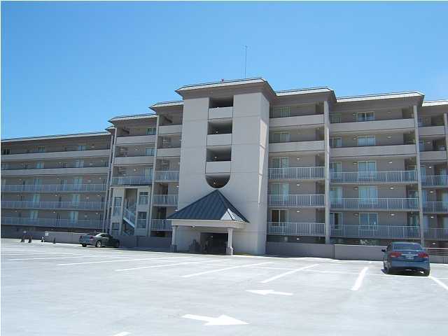 520 Santa Rosa Boulevard, Unit 110 Fort Walton Beach, FL 32548 - Photo 20 of 21 a front view of a building with parking