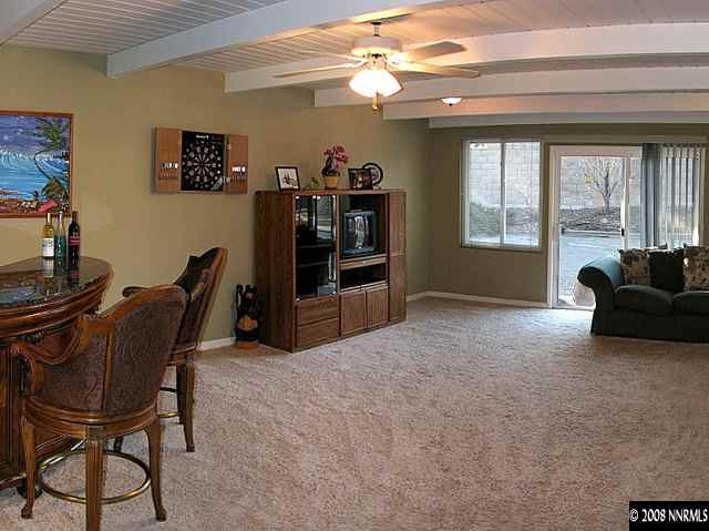 2145 Armstrong Lane Reno, NV 89509 - Photo 2 of 9 a living room with furniture and a flat screen tv
