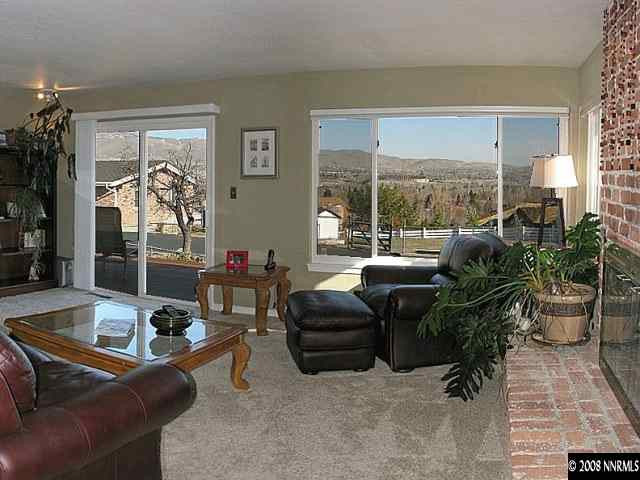 2145 Armstrong Lane Reno, NV 89509 - Photo 3 of 9 a living room with furniture and a large window
