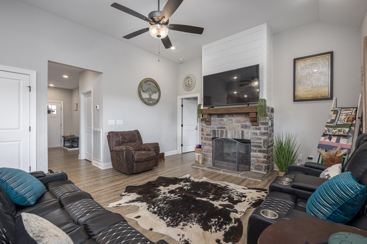 2743 West County Farm Road Springfield, TN 37172 - Photo 11 of 53 a living room with furniture a flat screen tv and a fireplace