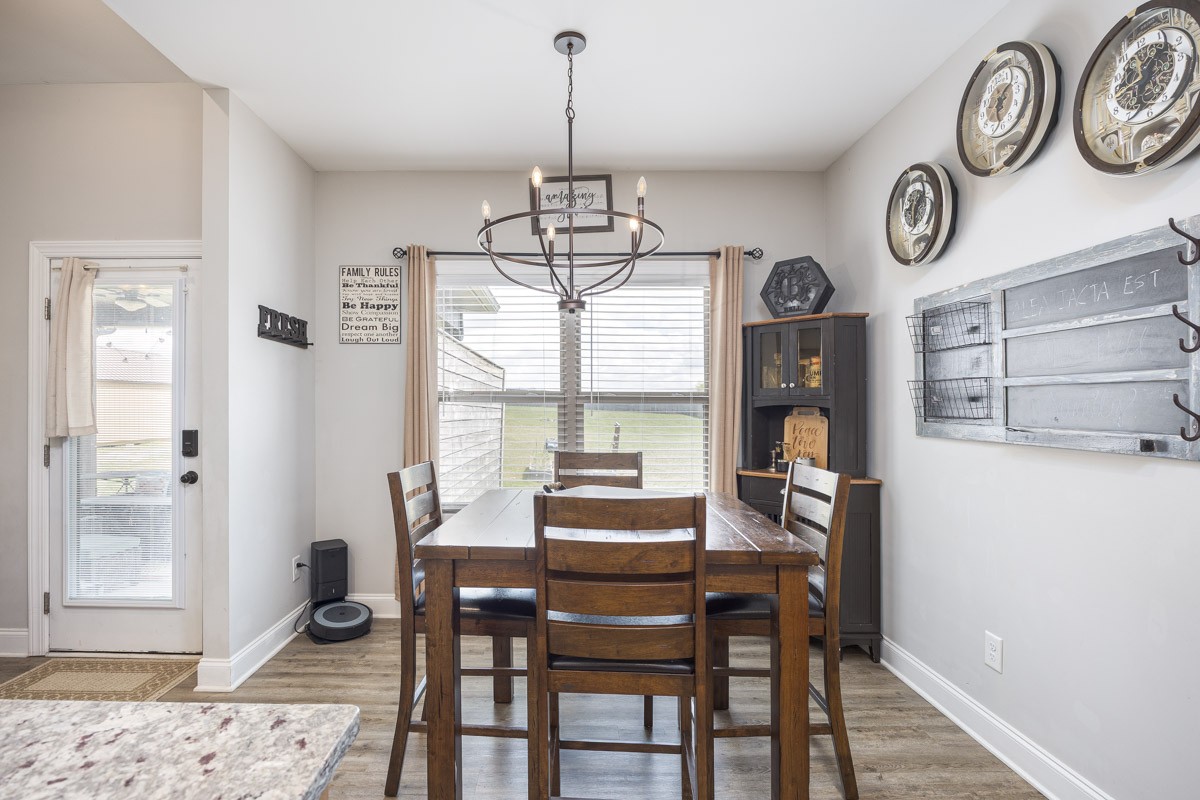 2743 West County Farm Road Springfield, TN 37172 - Photo 21 of 53 a view of a dining room with furniture window and wooden floor