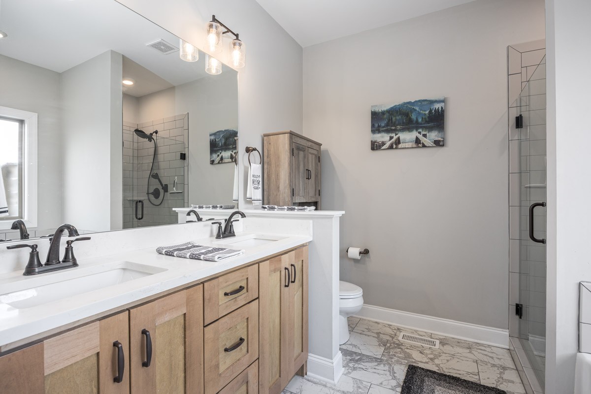 2743 West County Farm Road Springfield, TN 37172 - Photo 25 of 53 a bathroom with a sink a toilet a shower and a mirror