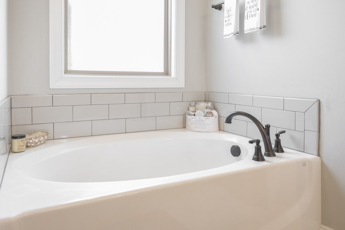 2743 West County Farm Road Springfield, TN 37172 - Photo 27 of 53 a white bath tub sitting in a bathroom
