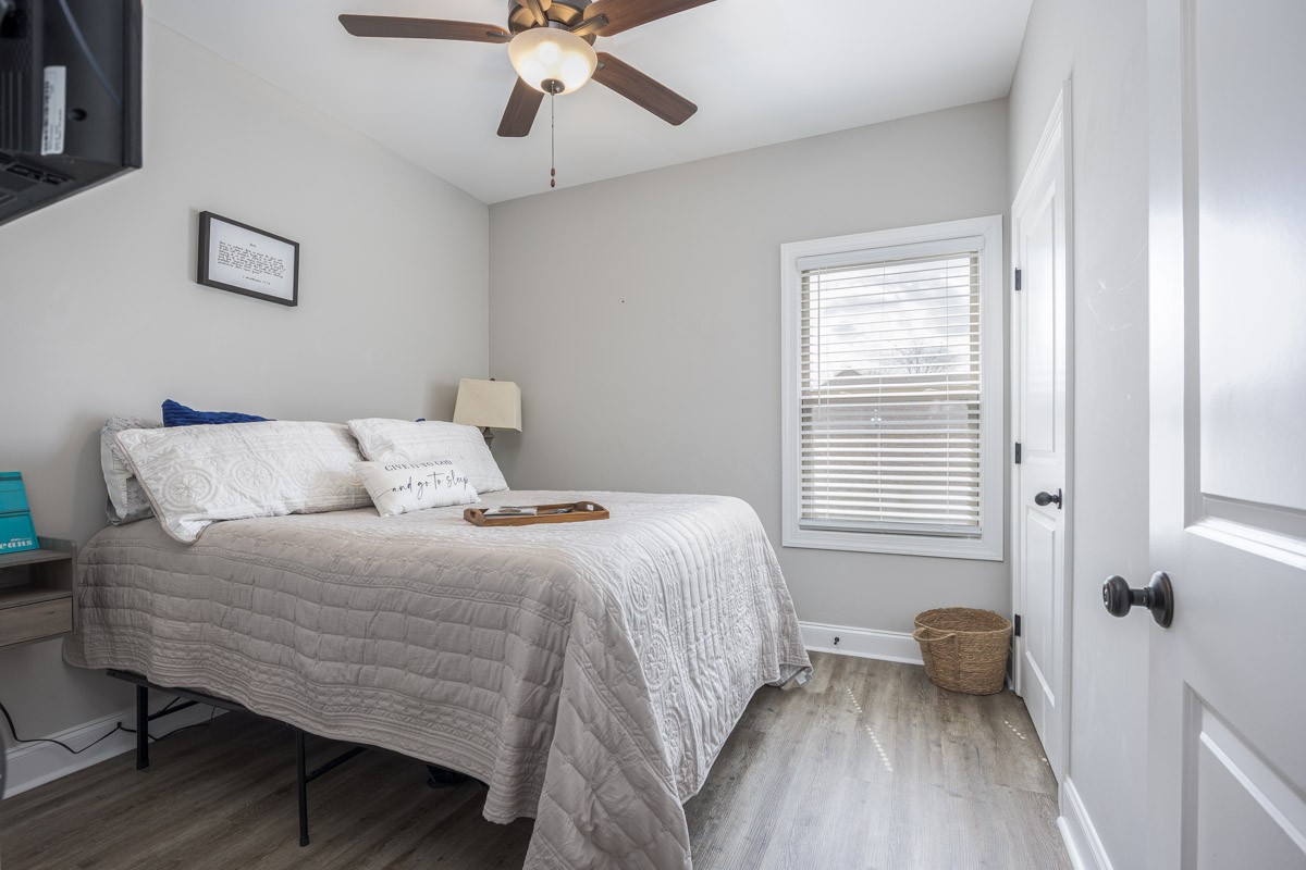 2743 West County Farm Road Springfield, TN 37172 - Photo 32 of 53 a bedroom with a bed and wooden floor