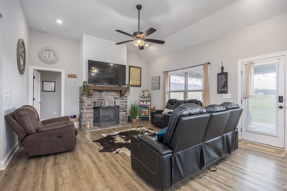 2743 West County Farm Road Springfield, TN 37172 - Photo 10 of 53 a living room with furniture a flat screen tv and a fireplace