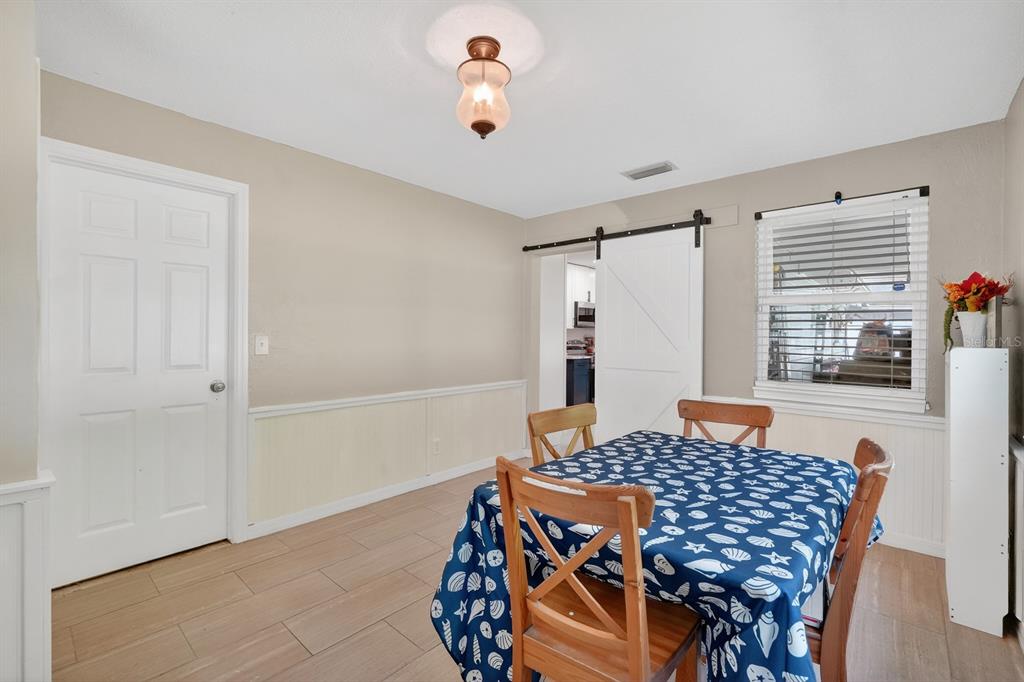 327 London Road Daytona Beach, FL 32117 - Photo 13 of 42 a bedroom with a bed and window