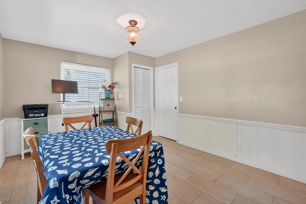 327 London Road Daytona Beach, FL 32117 - Photo 14 of 42 a view of a dining room with furniture