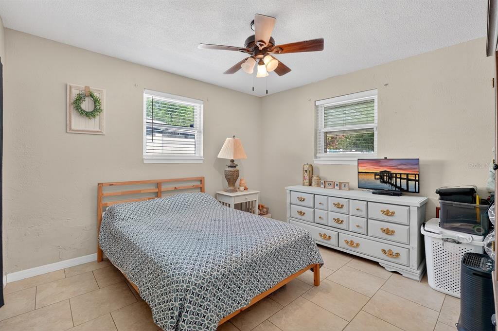 327 London Road Daytona Beach, FL 32117 - Photo 18 of 42 a bedroom with a bed and furniture