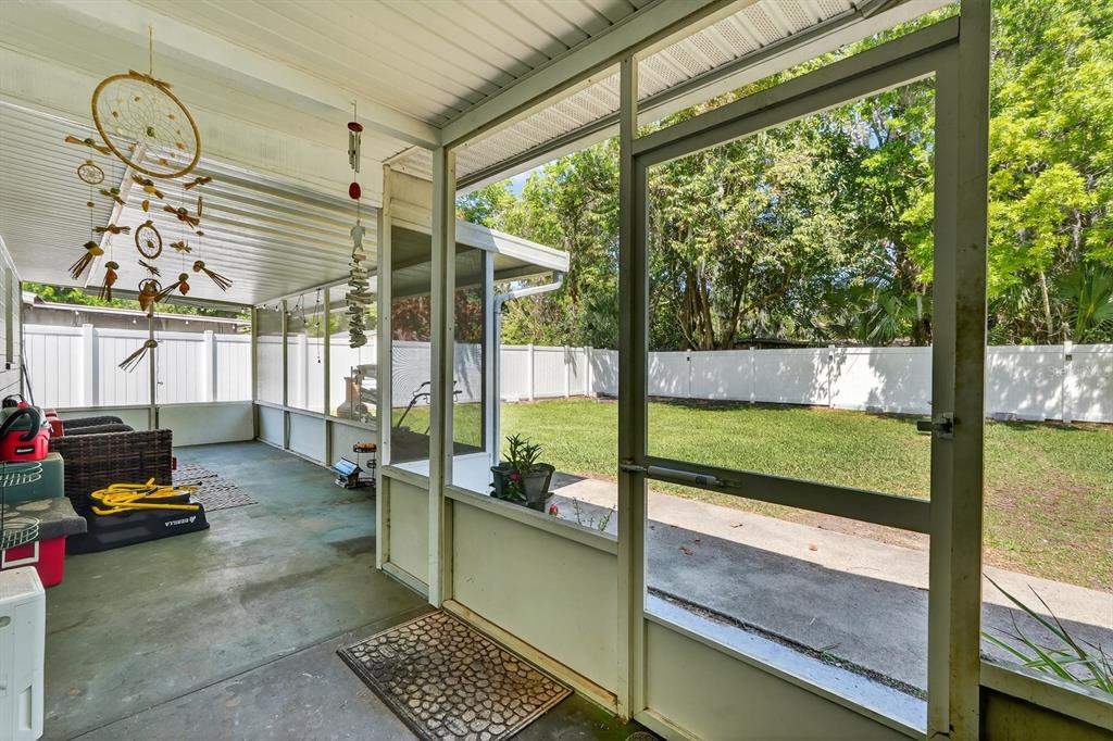 327 London Road Daytona Beach, FL 32117 - Photo 20 of 42 a living room with patio area