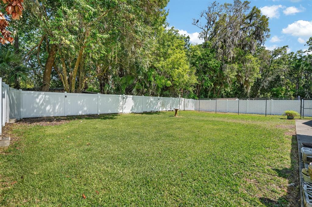 327 London Road Daytona Beach, FL 32117 - Photo 22 of 42 a view of garden with patio