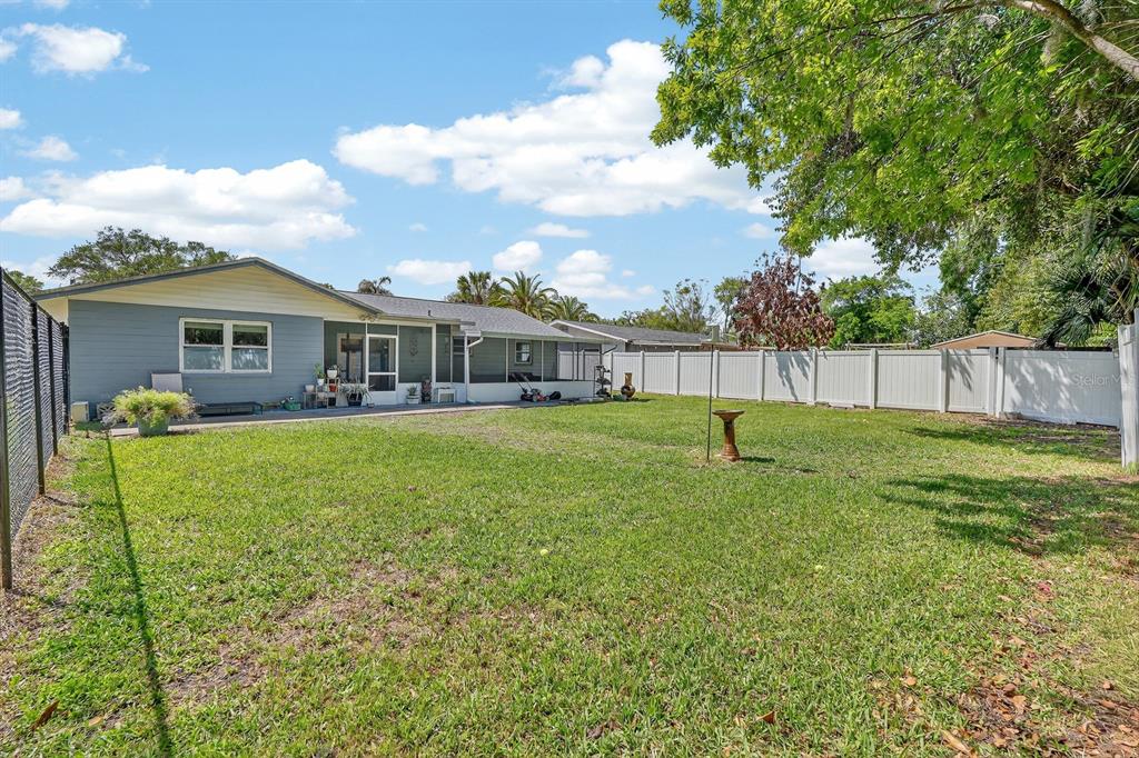 327 London Road Daytona Beach, FL 32117 - Photo 24 of 42 a view of a house with a backyard
