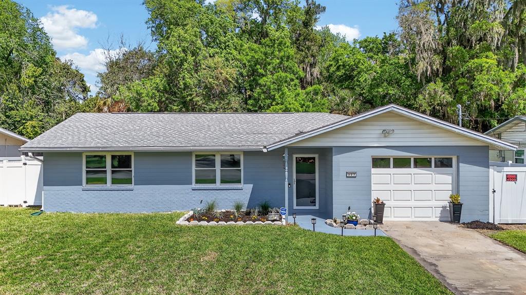 327 London Road Daytona Beach, FL 32117 - Photo 27 of 42 a front view of house with yard and green space