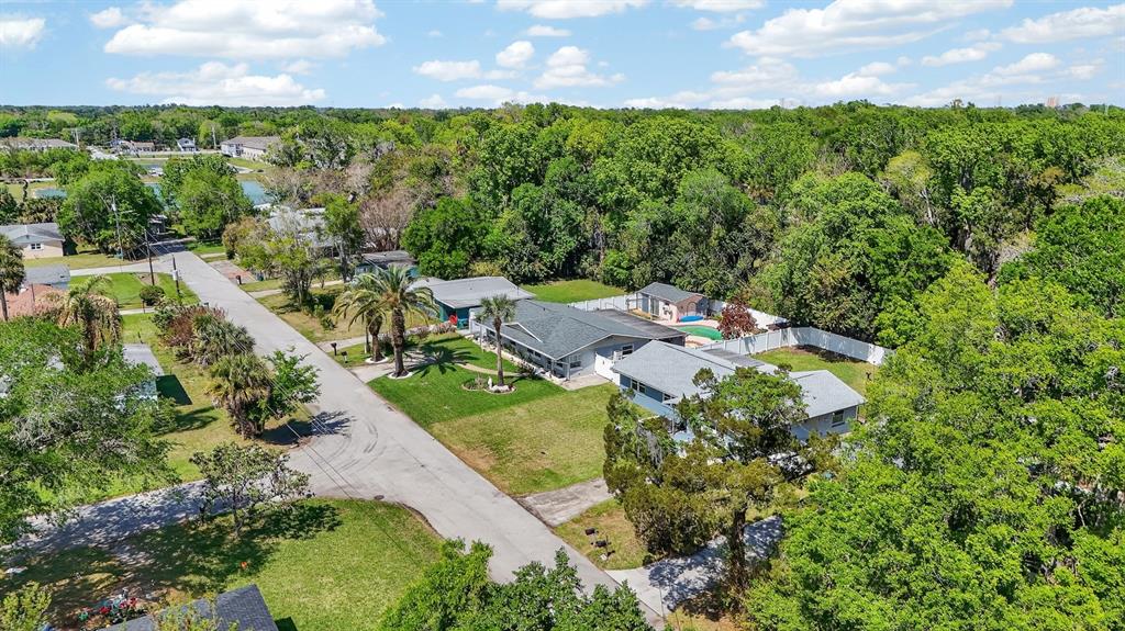 327 London Road Daytona Beach, FL 32117 - Photo 30 of 42 an aerial view of residential houses with outdoor space and trees all around