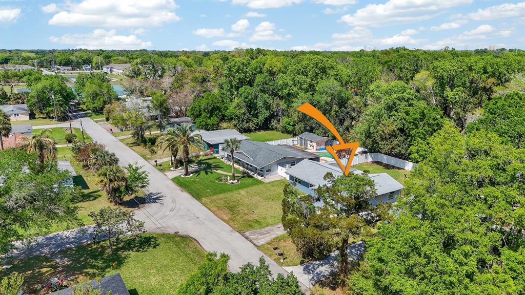 327 London Road Daytona Beach, FL 32117 - Photo 31 of 42 an aerial view of a house with a garden and swimming pool