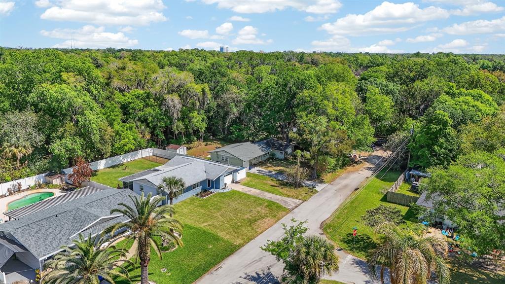 327 London Road Daytona Beach, FL 32117 - Photo 32 of 42 an aerial view of a house with swimming pool and garden