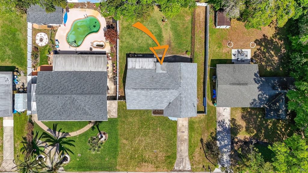 327 London Road Daytona Beach, FL 32117 - Photo 35 of 42 an aerial view of a house with swimming pool and large trees