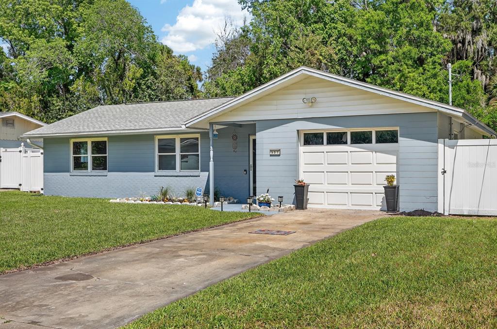 327 London Road Daytona Beach, FL 32117 - Photo 39 of 42 a front view of a house with a yard