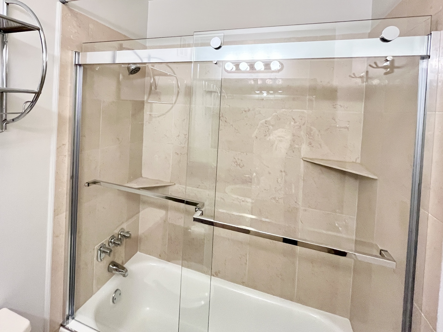 100 East Walton Place, Unit 14A Chicago, IL 60611 - Photo 11 of 19 a bathroom with a shower and a tub