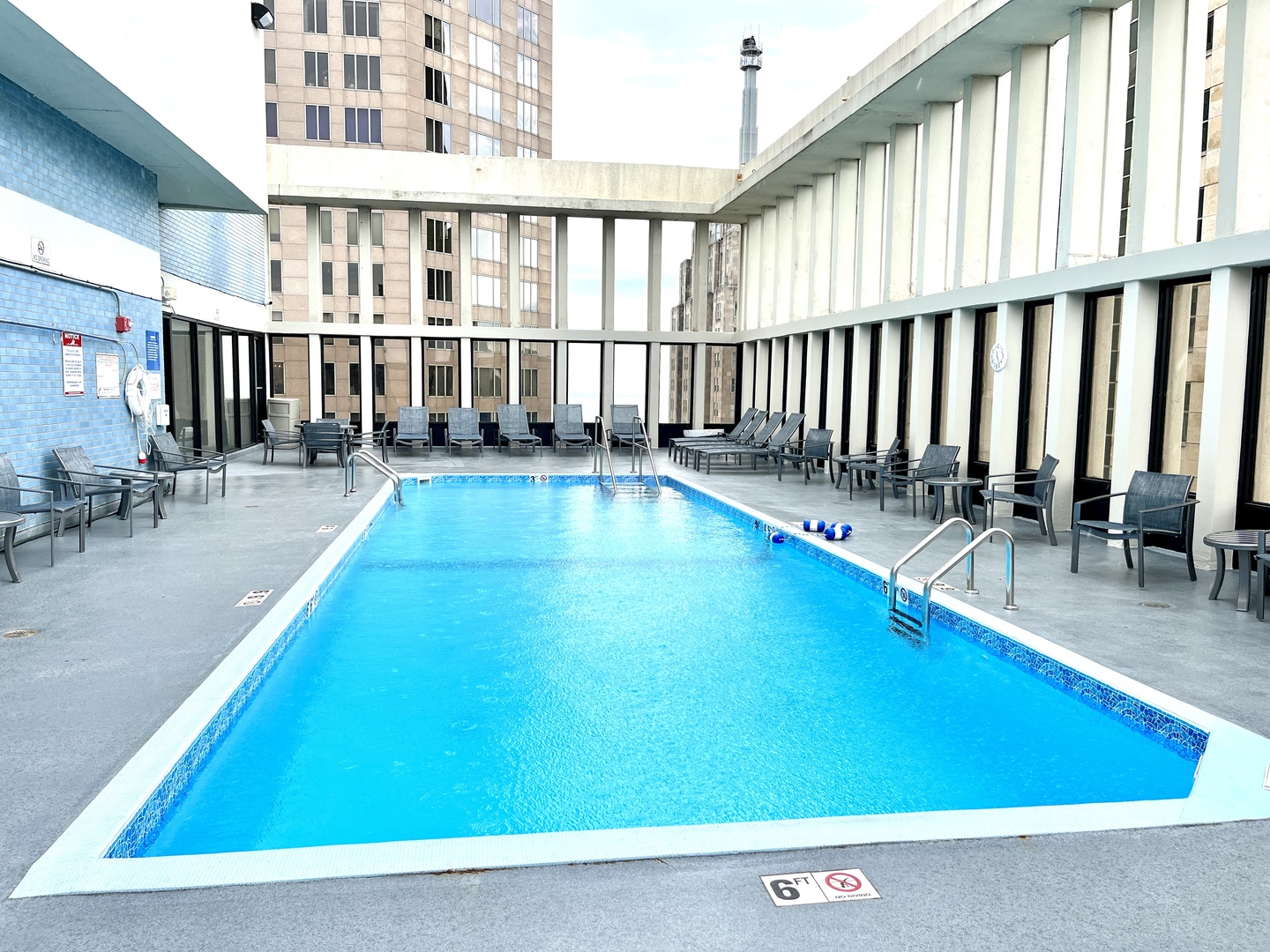100 East Walton Place, Unit 14A Chicago, IL 60611 - Photo 14 of 19 wooden floor with pool table and chairs