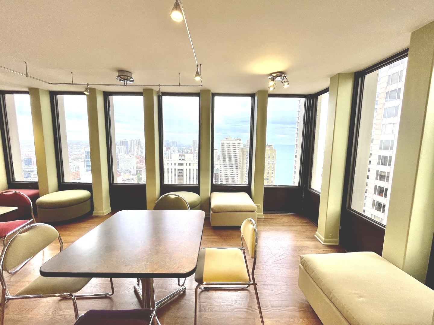 100 East Walton Place, Unit 14A Chicago, IL 60611 - Photo 17 of 19 a living room with furniture and a large window